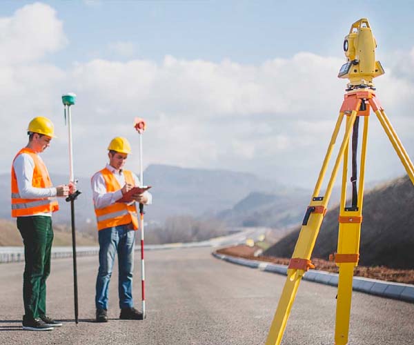 engineer-surveyor-working-with-theodolite-at-construction-site.jpg